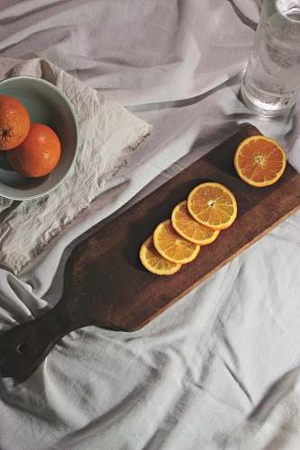 citrus fruit lemon slices on cutting board food